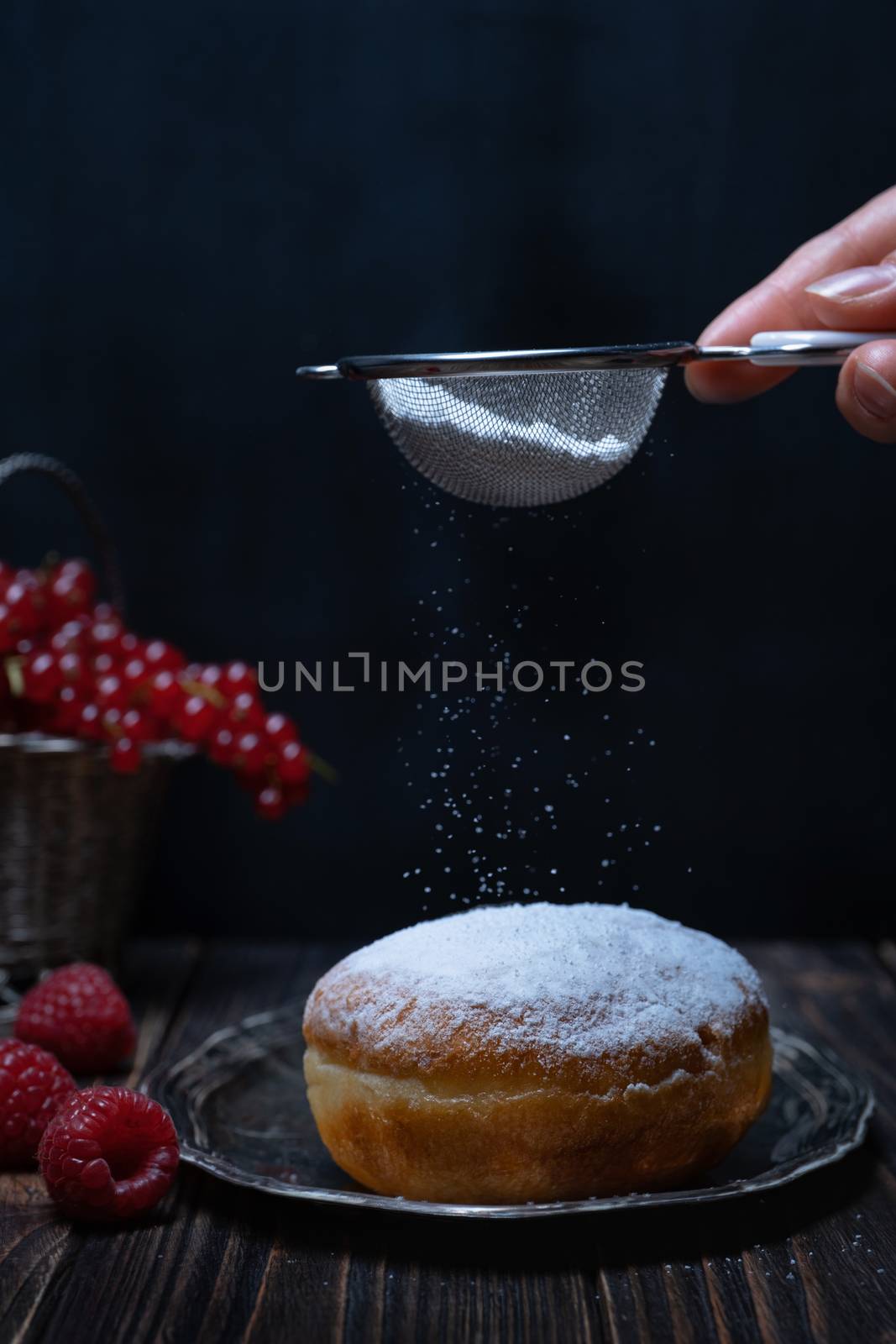 Berliner jelly filled doughnut with raspberry and redcurrant. by Fischeron