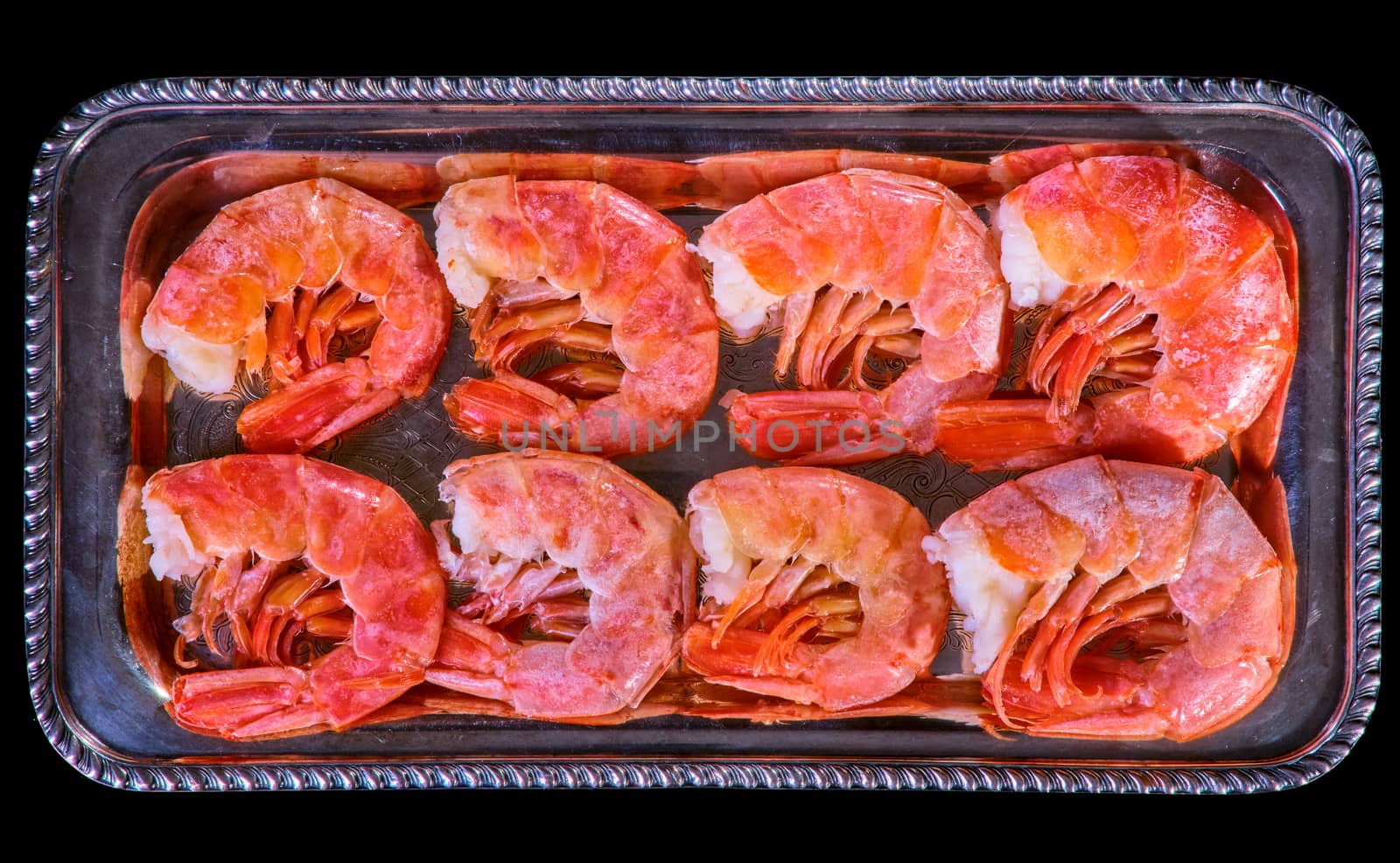 Healthy diet food: boiled wild tiger shrimps close-up on a plate on a table. by Fischeron