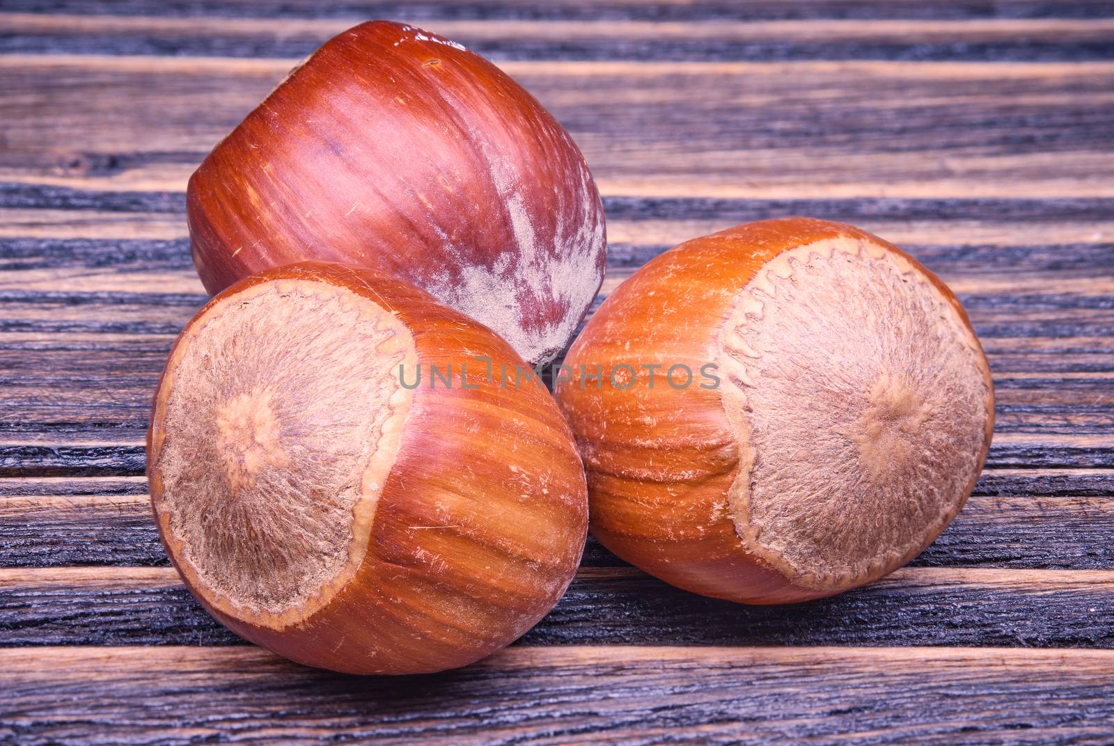 Close up Hazelnuts vegetarian food on old wooden background.