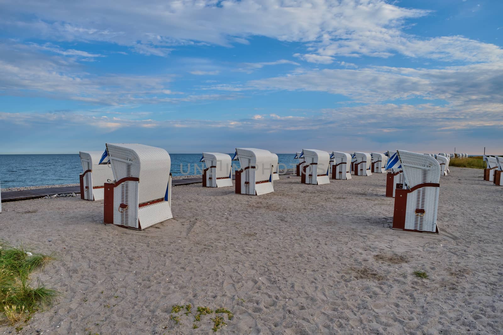 Empty beach cabins on a deserted beach at the baltic sea in the morning.