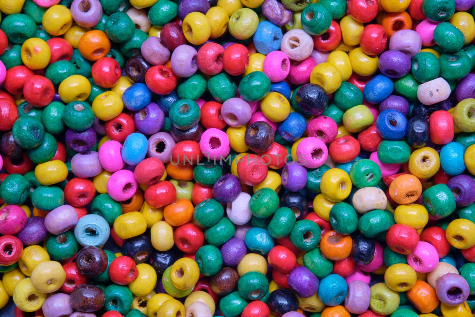 Various sewing Colorful wooden beads as background by Fischeron