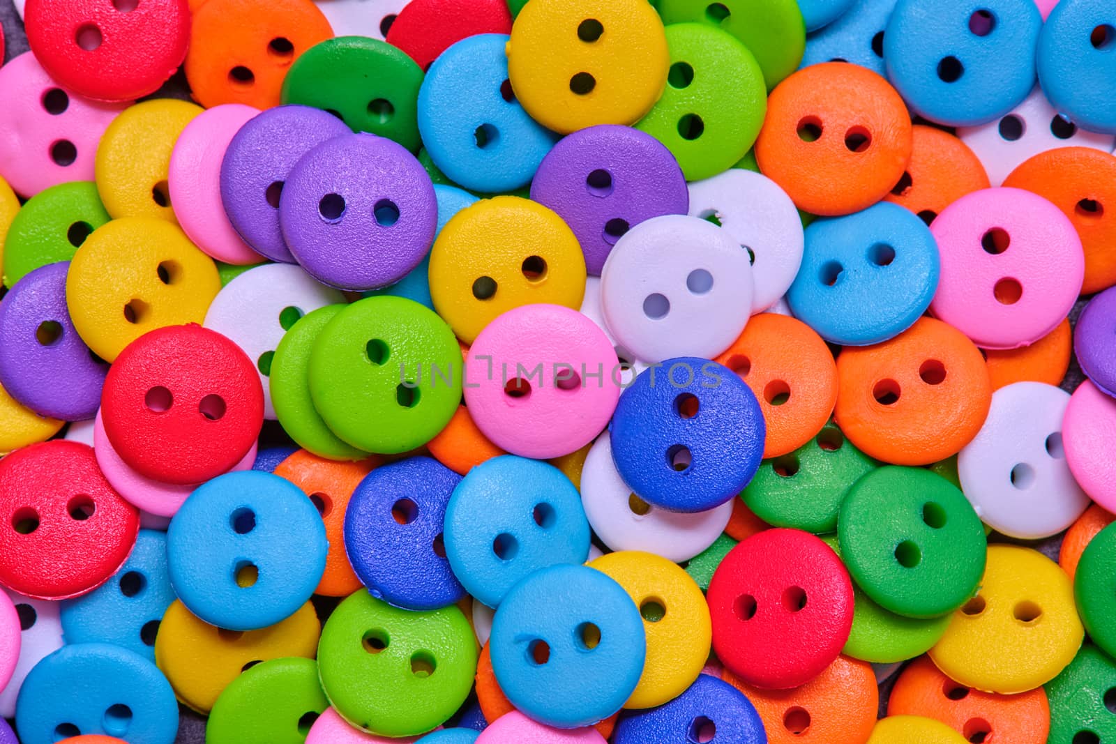 Various sewing Colorful plastic buttons as background by Fischeron