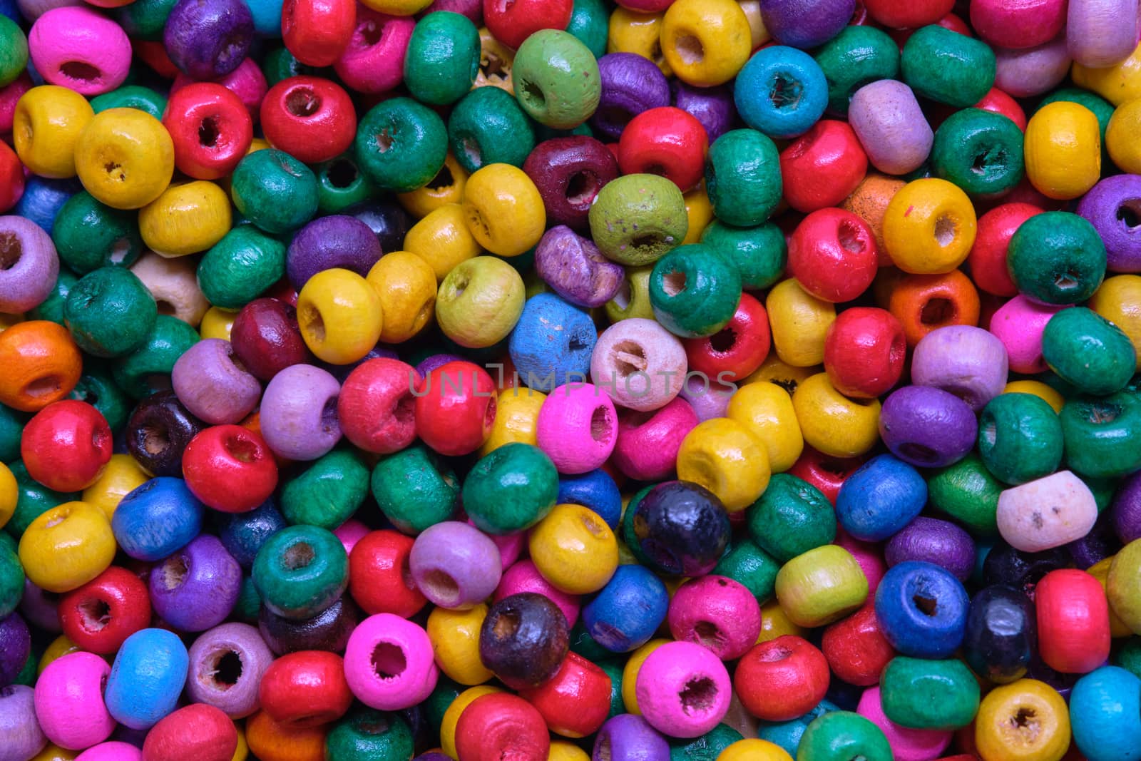Various sewing Colorful wooden beads as background.