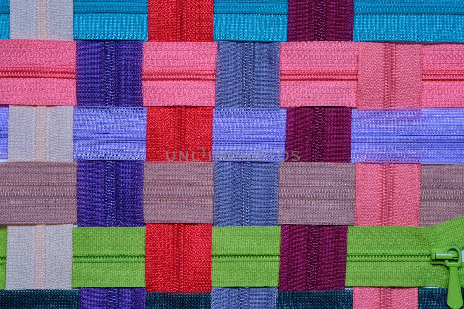 Colorful zipper for sewing and arrange as a background by Fischeron