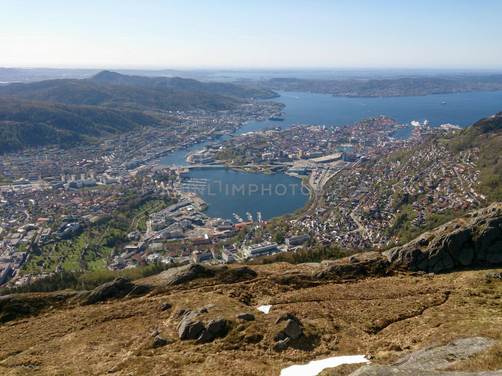 Aerial and high angle view over the city of Bergen, Norway, with districts and surrounding water. Cityscape and skyline.