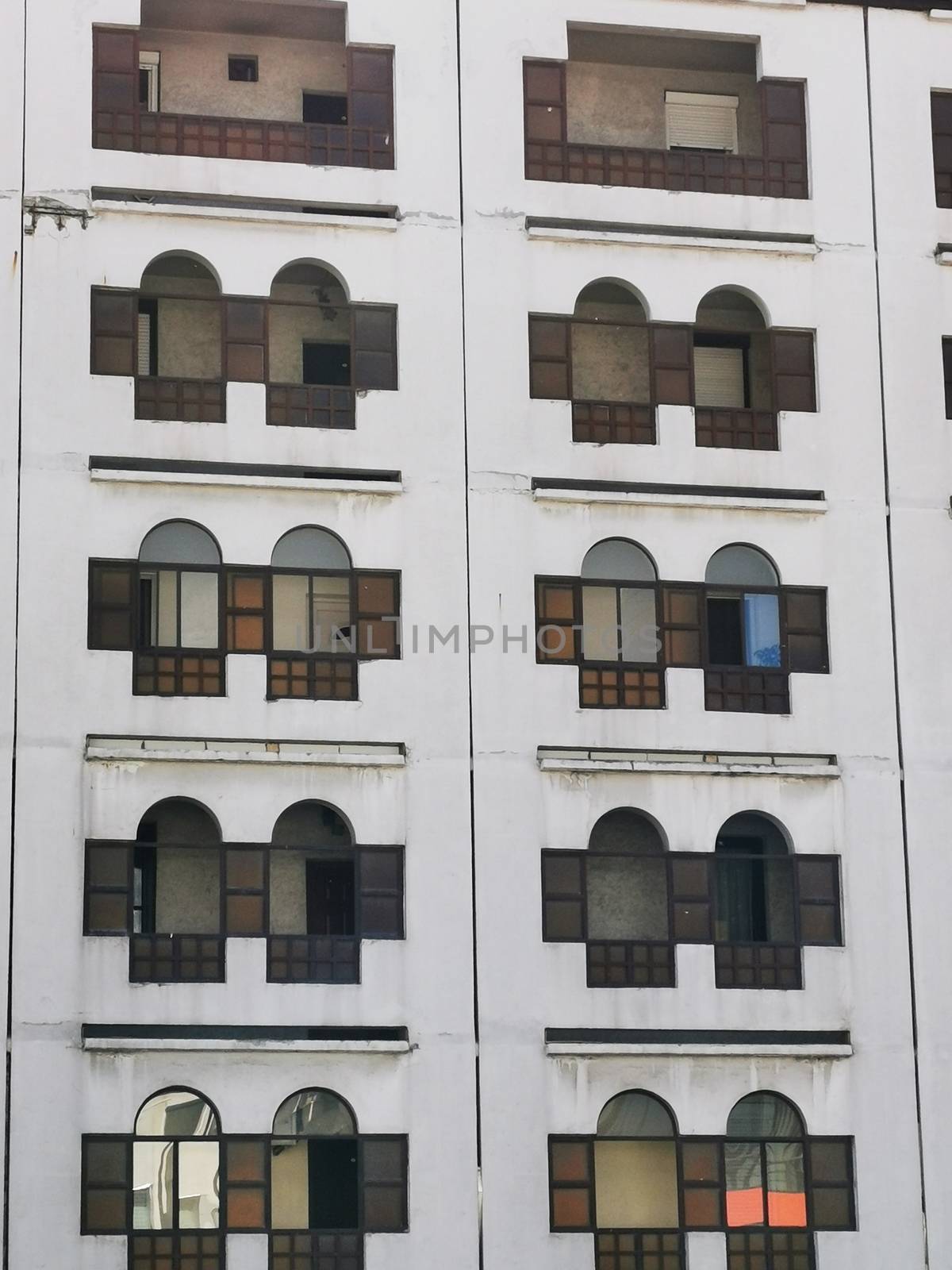 Windows of a great white building in Miskolc High quality photo