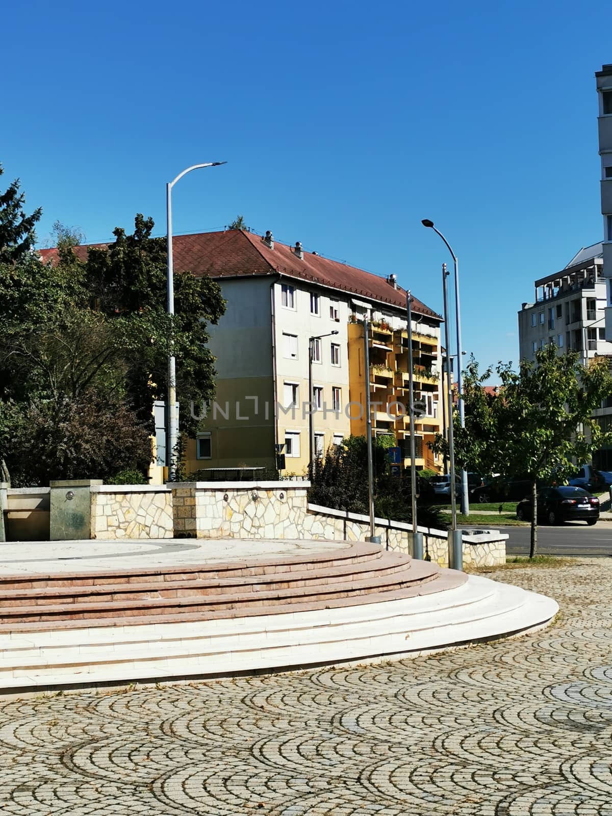 A street scene with focus on the side of a building in Miskolc by balage941