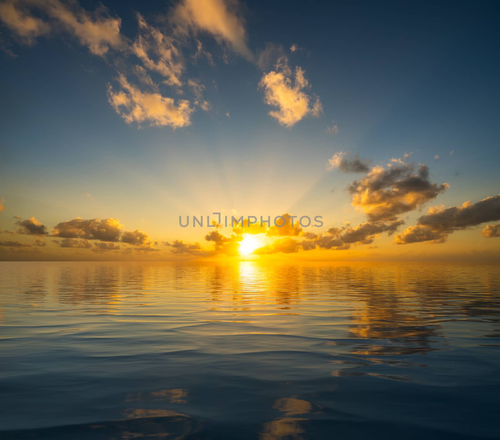 Dramatic sunrise or sunset reflected into the calm waters of an artificial ocean to represent peace or heaven