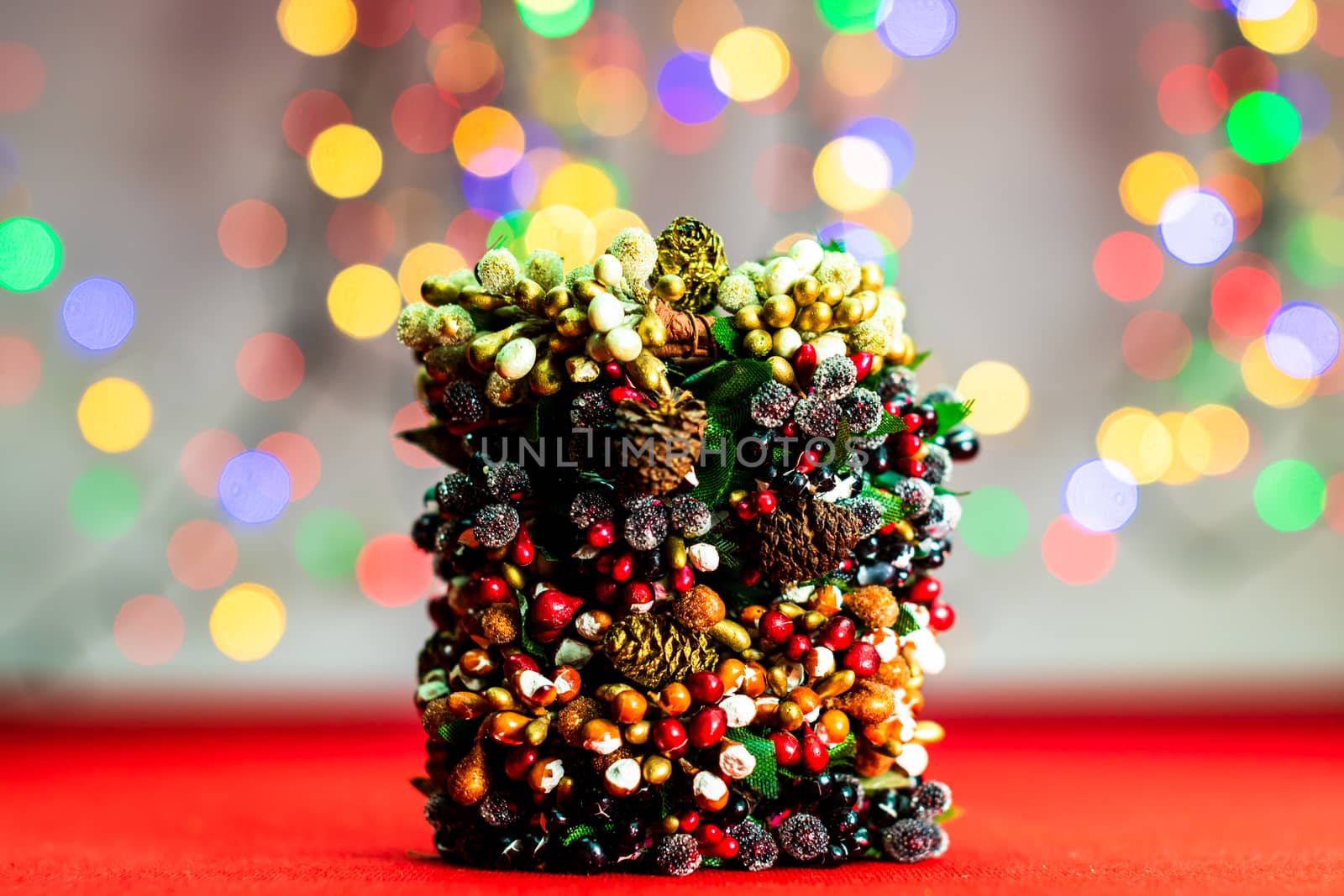 Colorful decorated Christmas wreaths isolated on background of blurred lights.