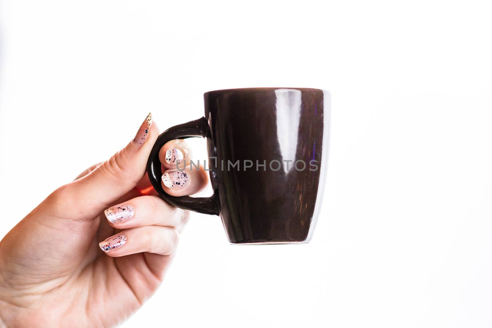 Woman hand holding a cup isolated on white background.