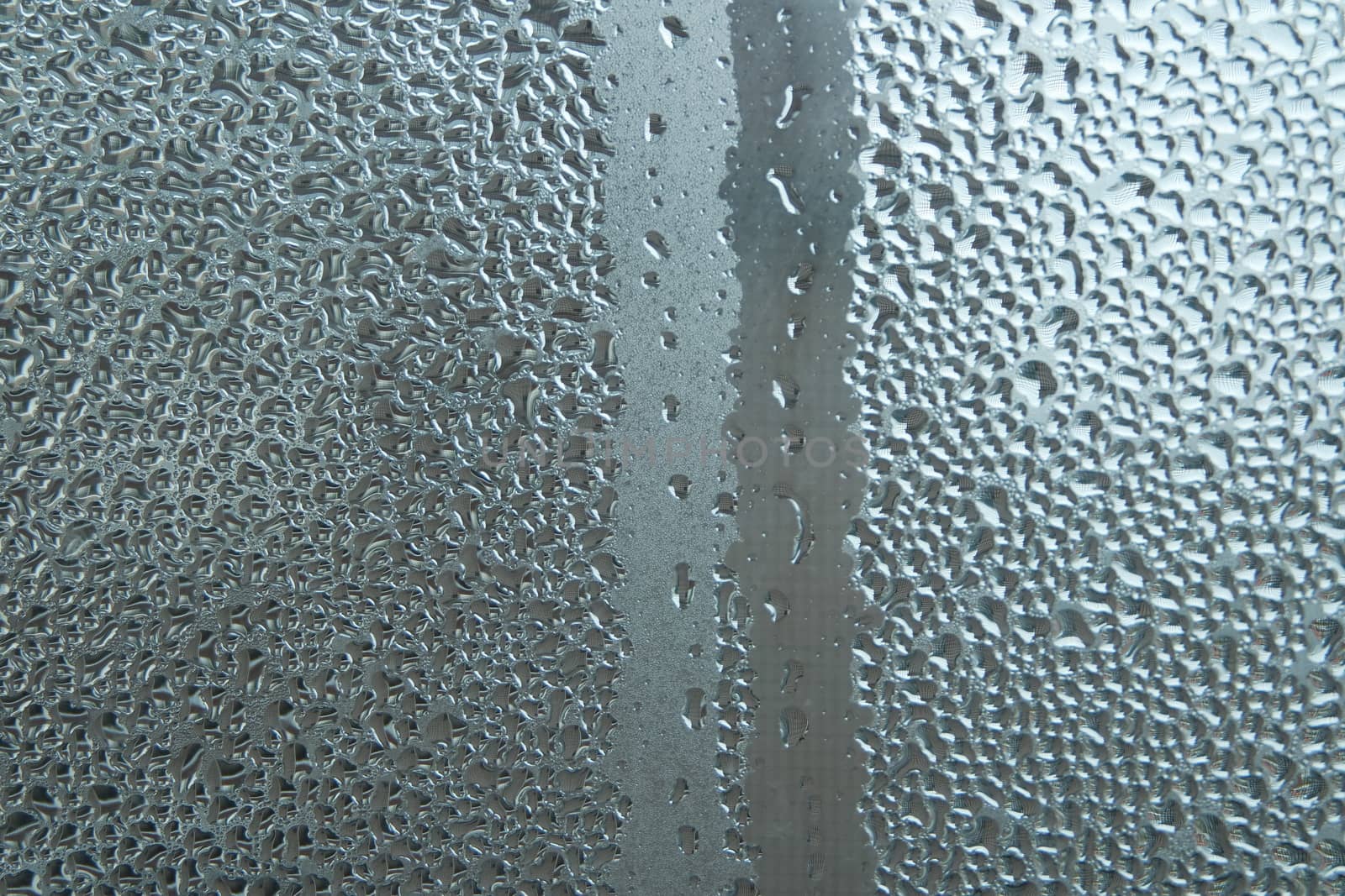 Bright grey color glassy texture, with water drops on it. Water drop glassy background
