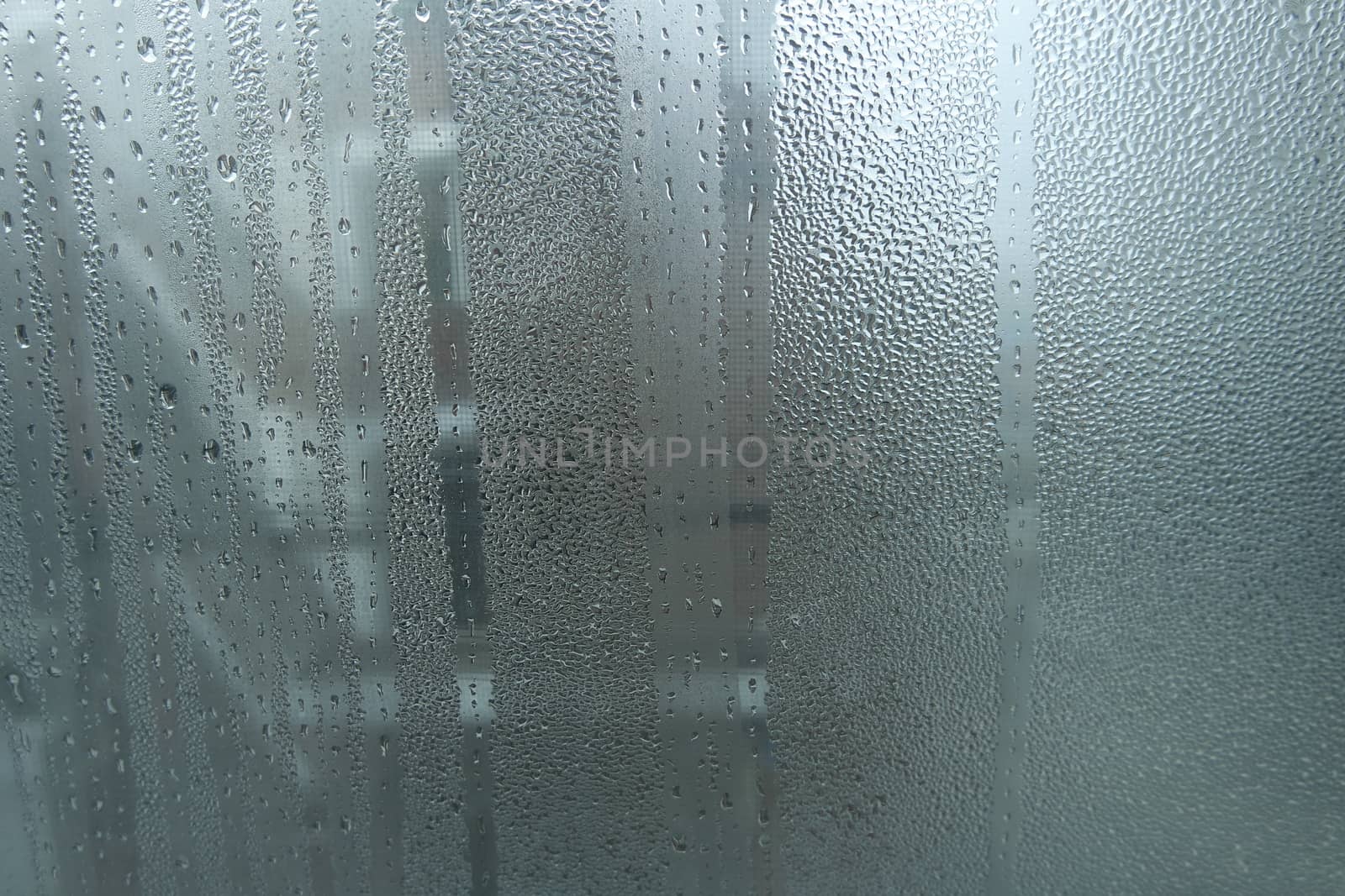 Bright grey color glassy texture, with water drops on it. Water drop glassy background