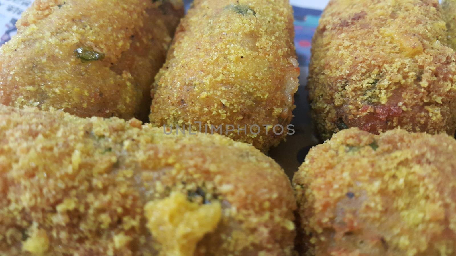 Closeup perspective view of home made spicy and delicious croquettes served with tea or other dishes during parties as fast food.