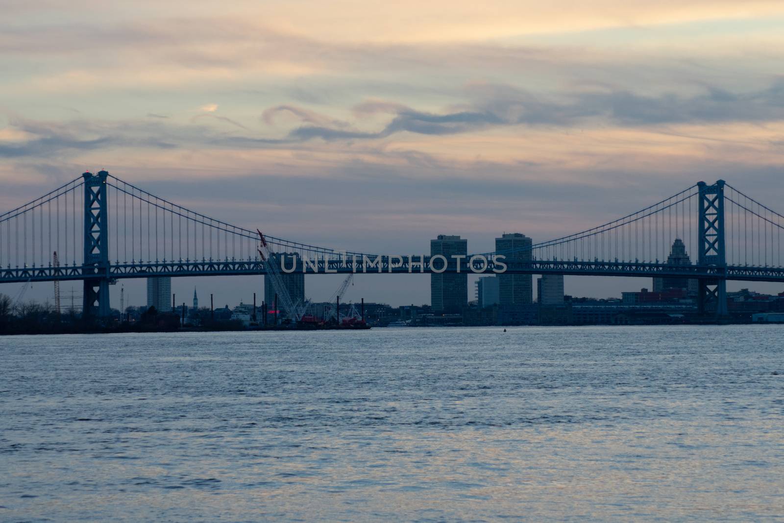 A View of the Ben Franklin Bridge Over Water on a Dramatic Sky