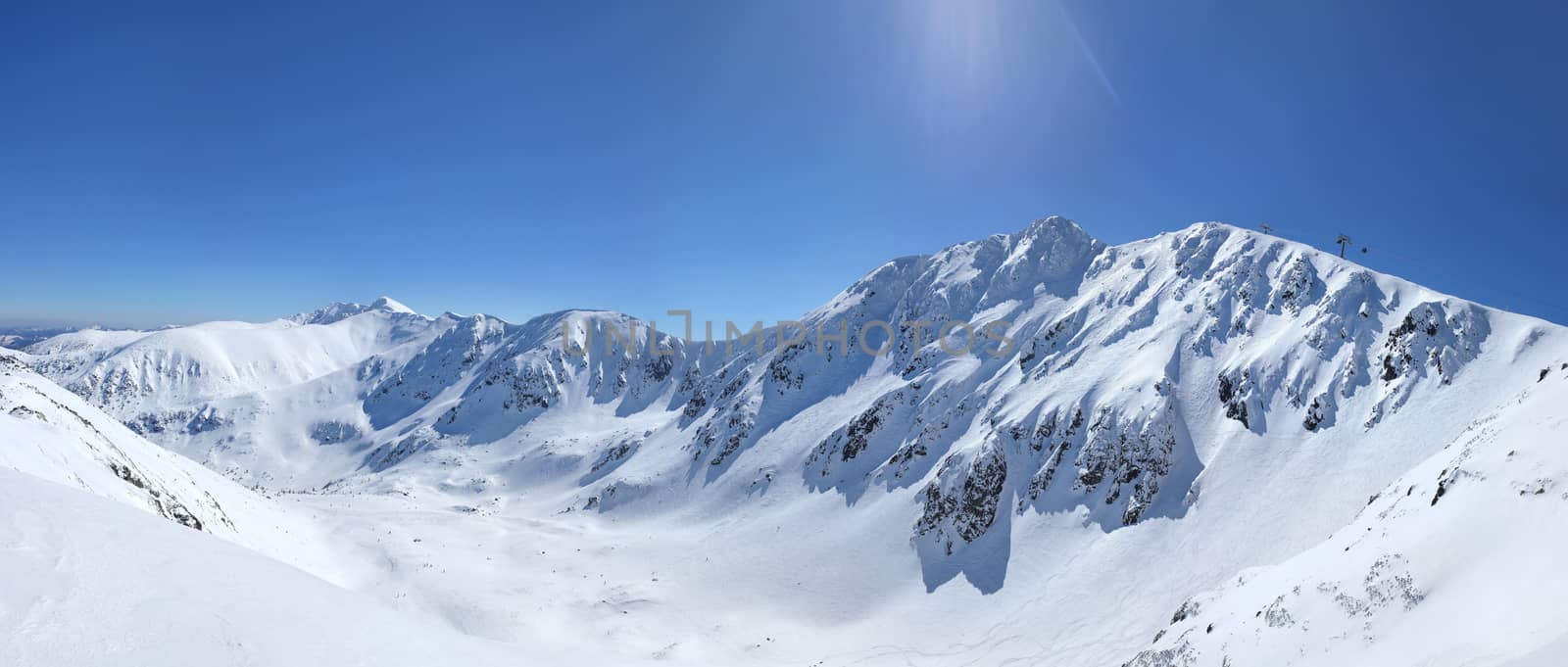 High resolution (100mpx+) panorama of snow covered mount Chopok peak in Jasna, Low Tatras, Slovakia on a bright sunny winter day.