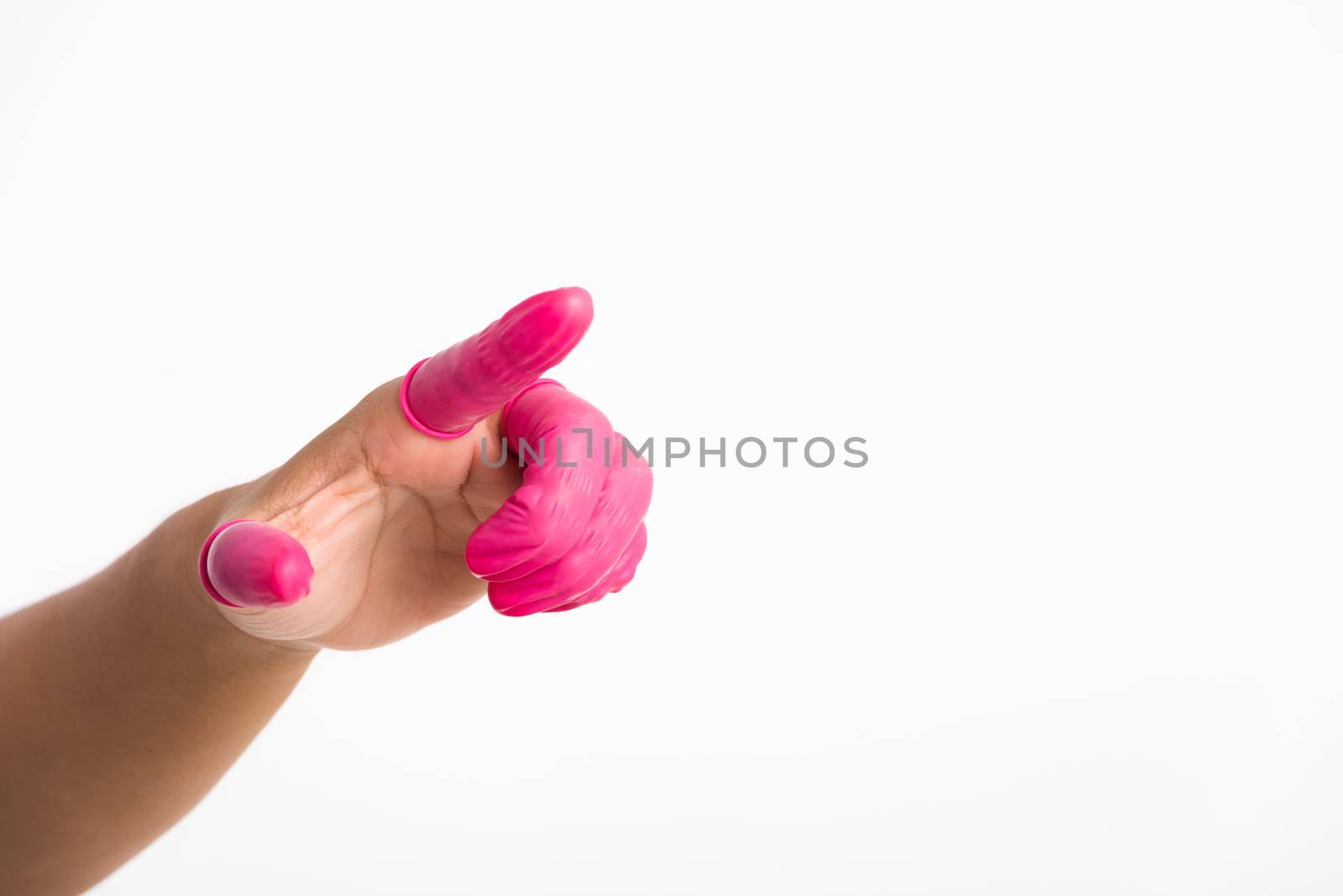 Woman hand wearing pink finger cots rubber protect help prevent fingerprints on the finger touched piece with poinging finger, studio shot isolated on white background