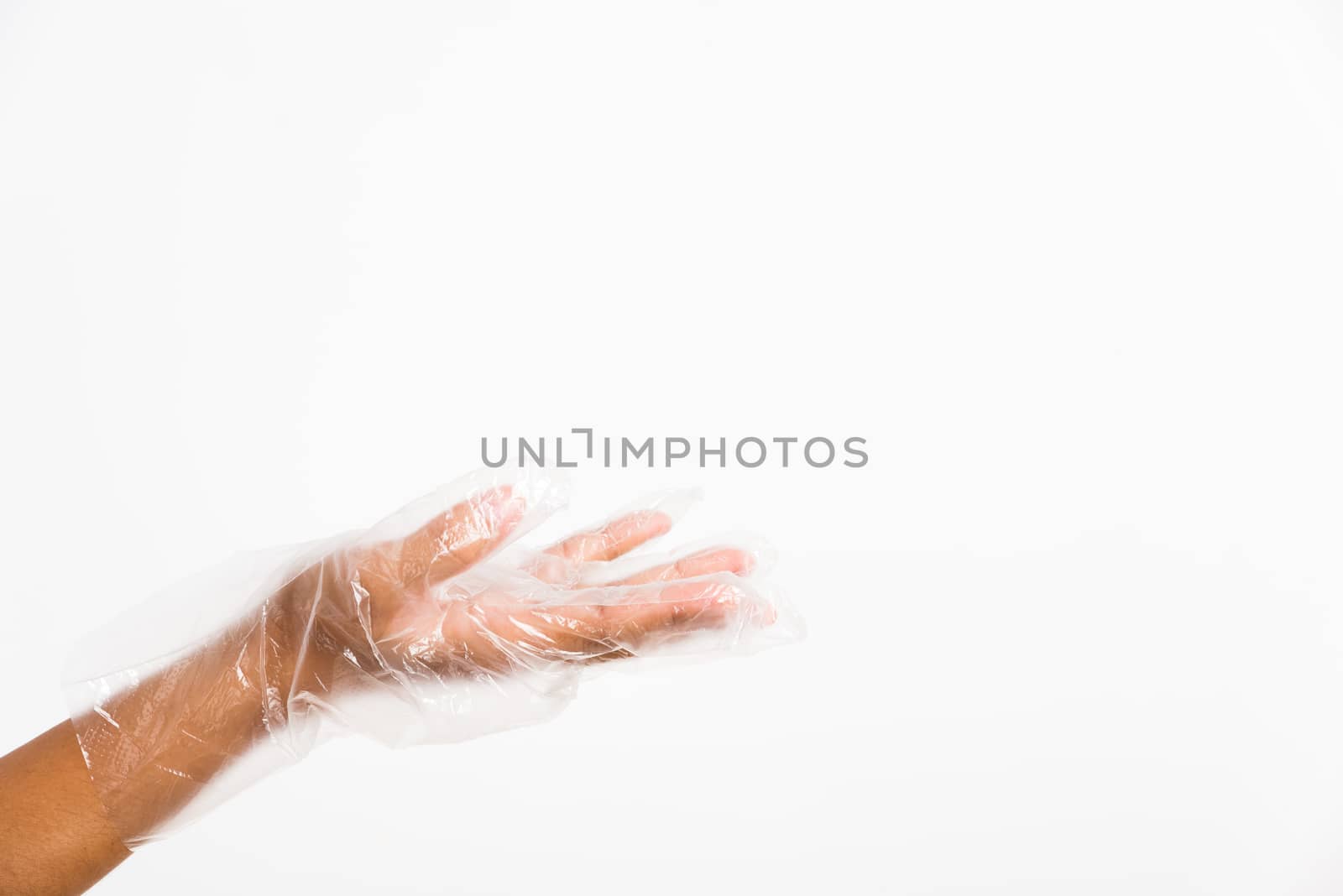 Woman hand wearing single use protect disposable transparent pla by Sorapop