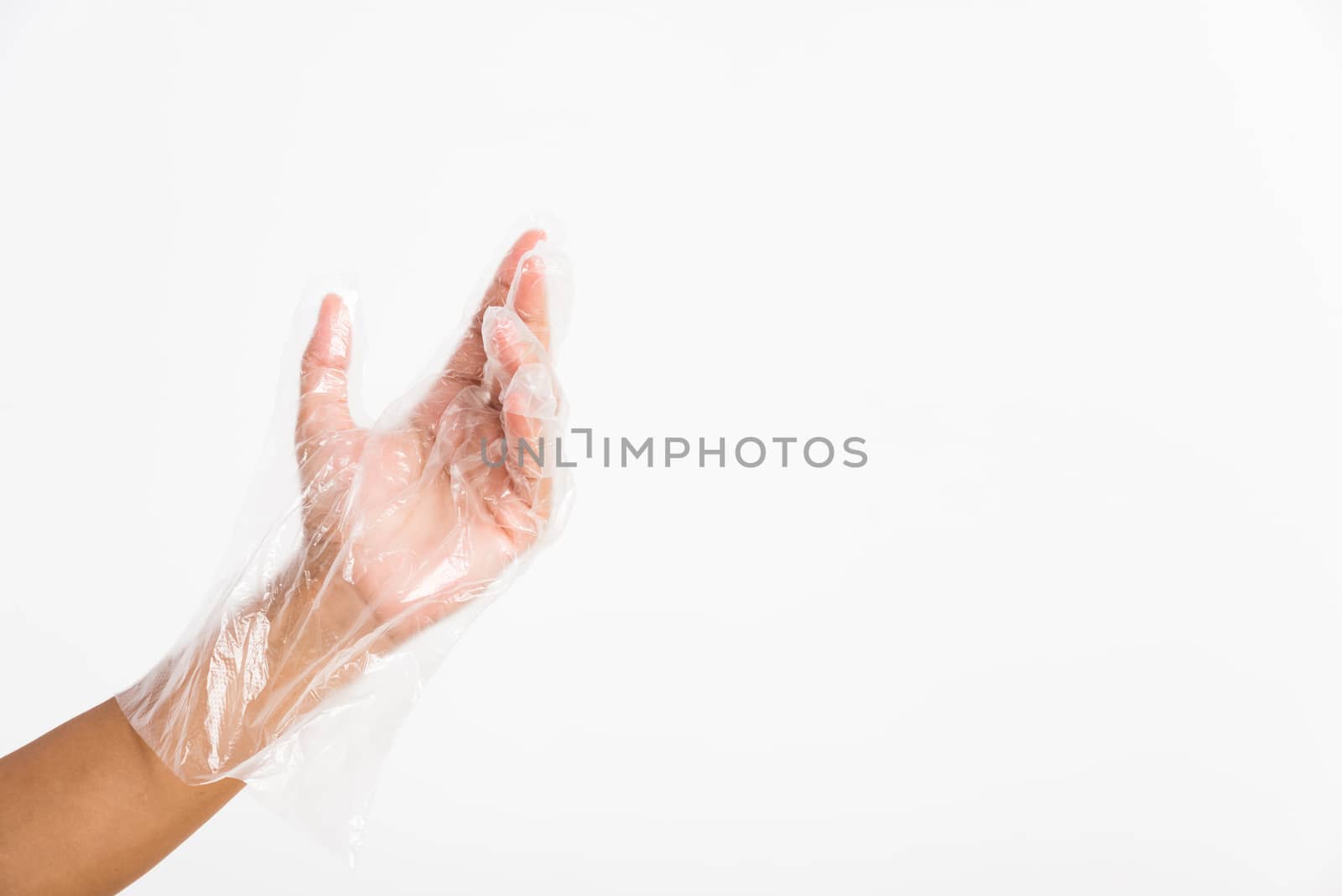 Woman hand wearing single use protect disposable transparent pla by Sorapop