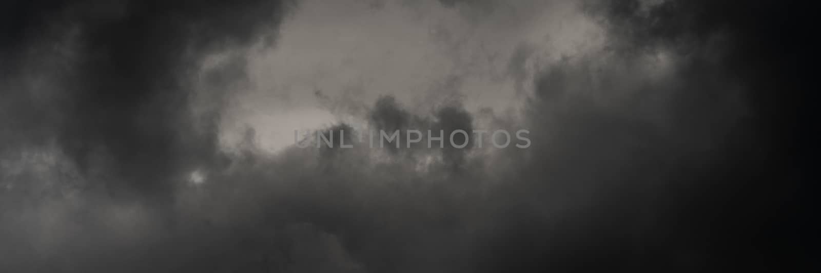 Panorama dramatic storm clouds in dusk sky, rainy and overcast weather. Natural meteorology background. Soft focus, motion blur sky wanderlust panoramic cloudscape.
