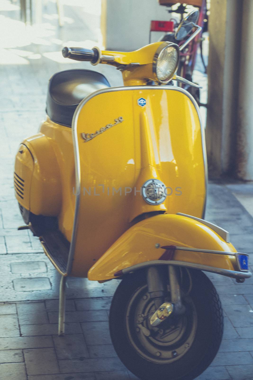 terni,italy september 05 2020:vintage piaggio vespa in yellow color