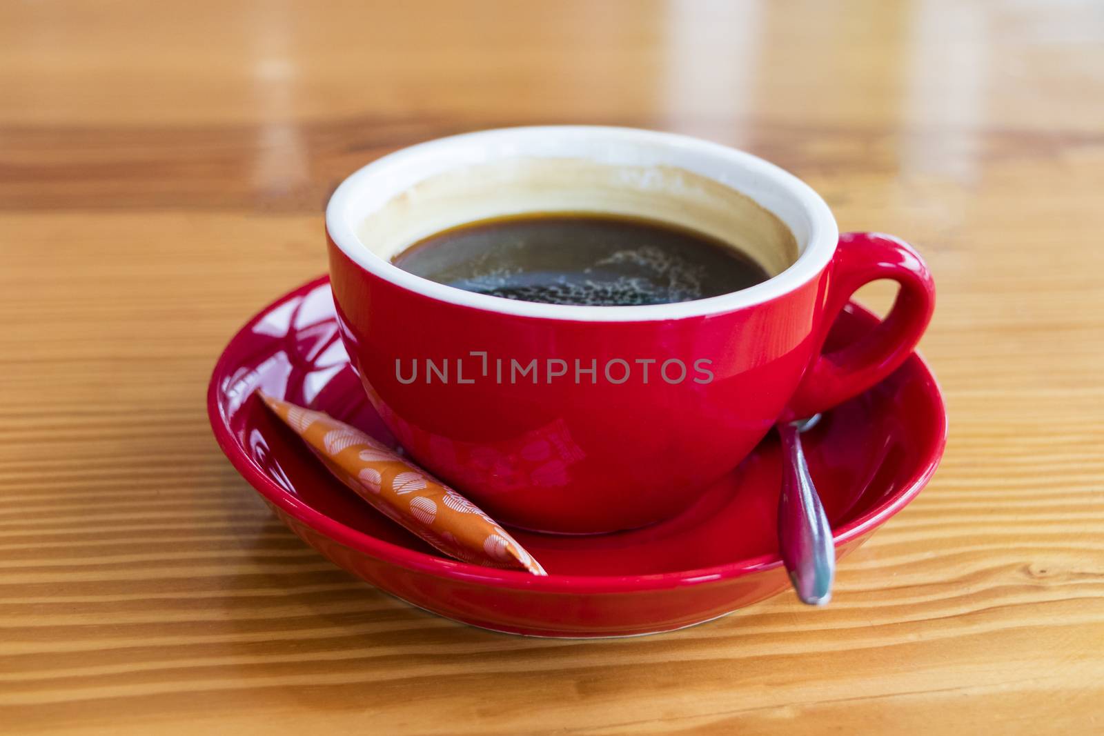 Organic black coffee Vietnam in a red cup. by Arkadij