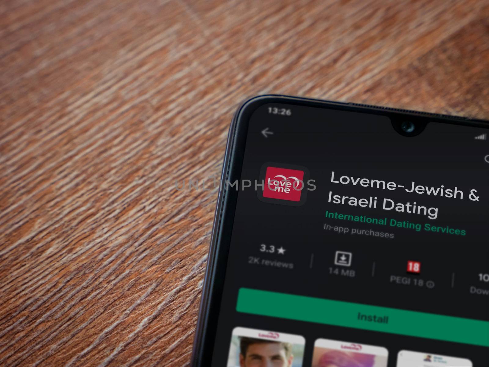 Loveme app play store page on the display of a black mobile smar by wavemovies