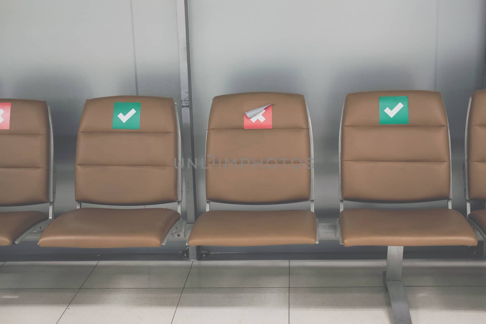 social distancing passenger chair in airport. coronavirus covid-19 pandemic prevention