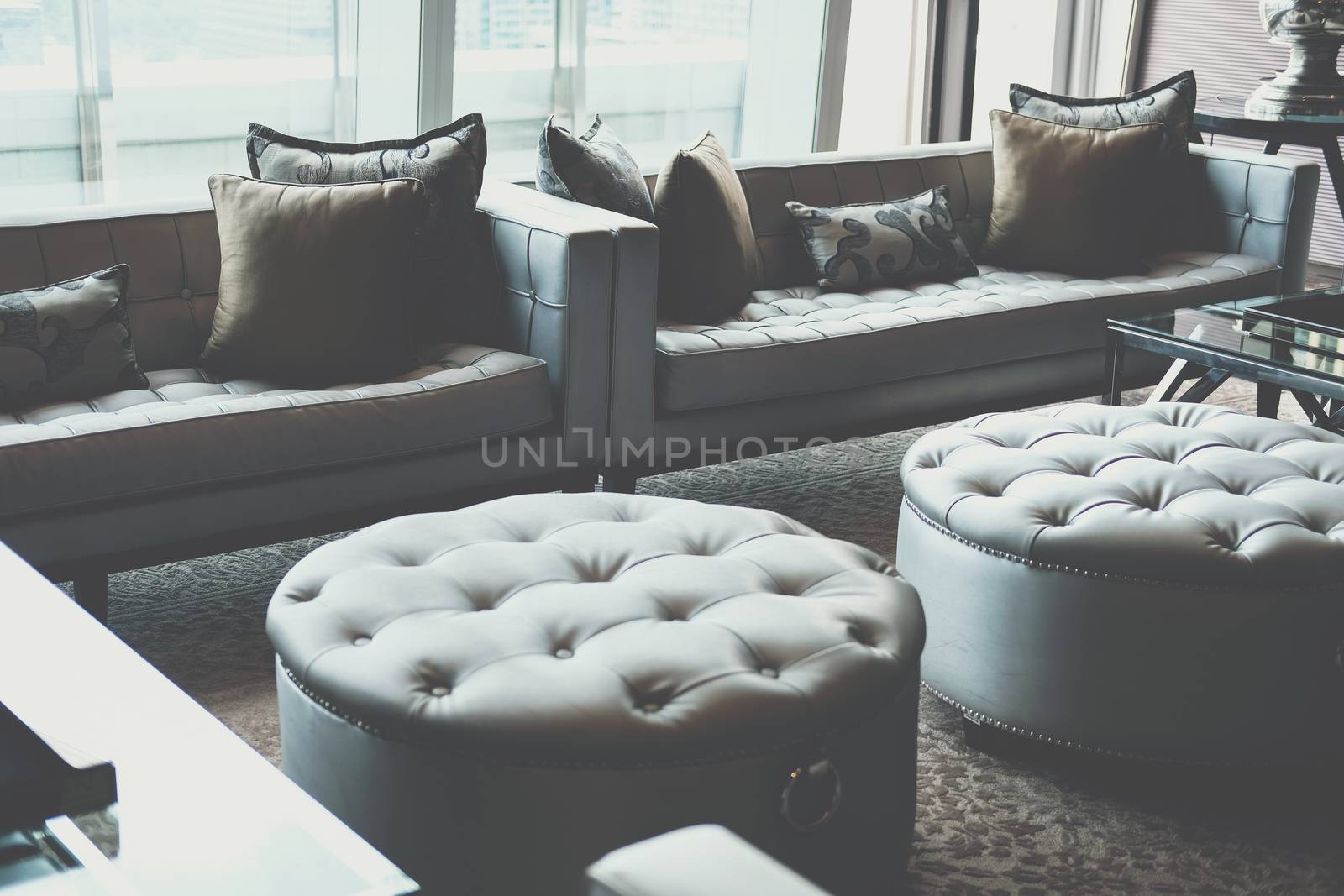 gray sofa chair in living room. home hotel resort interior