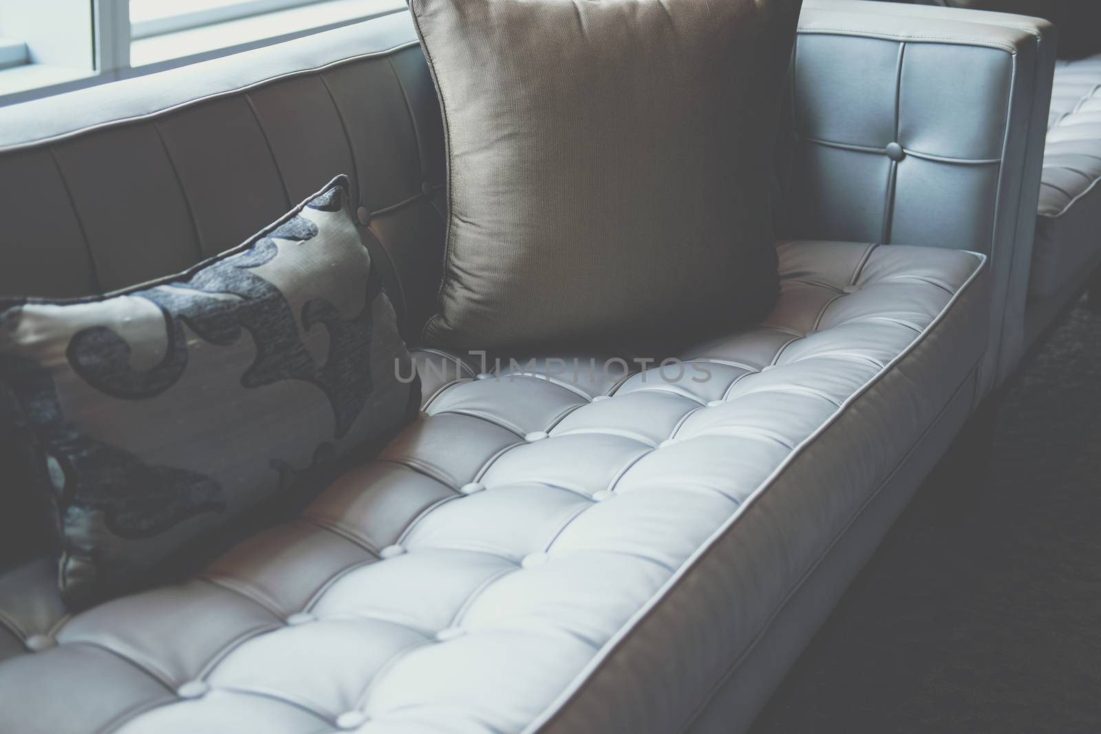 gray sofa chair in living room. home hotel resort interior