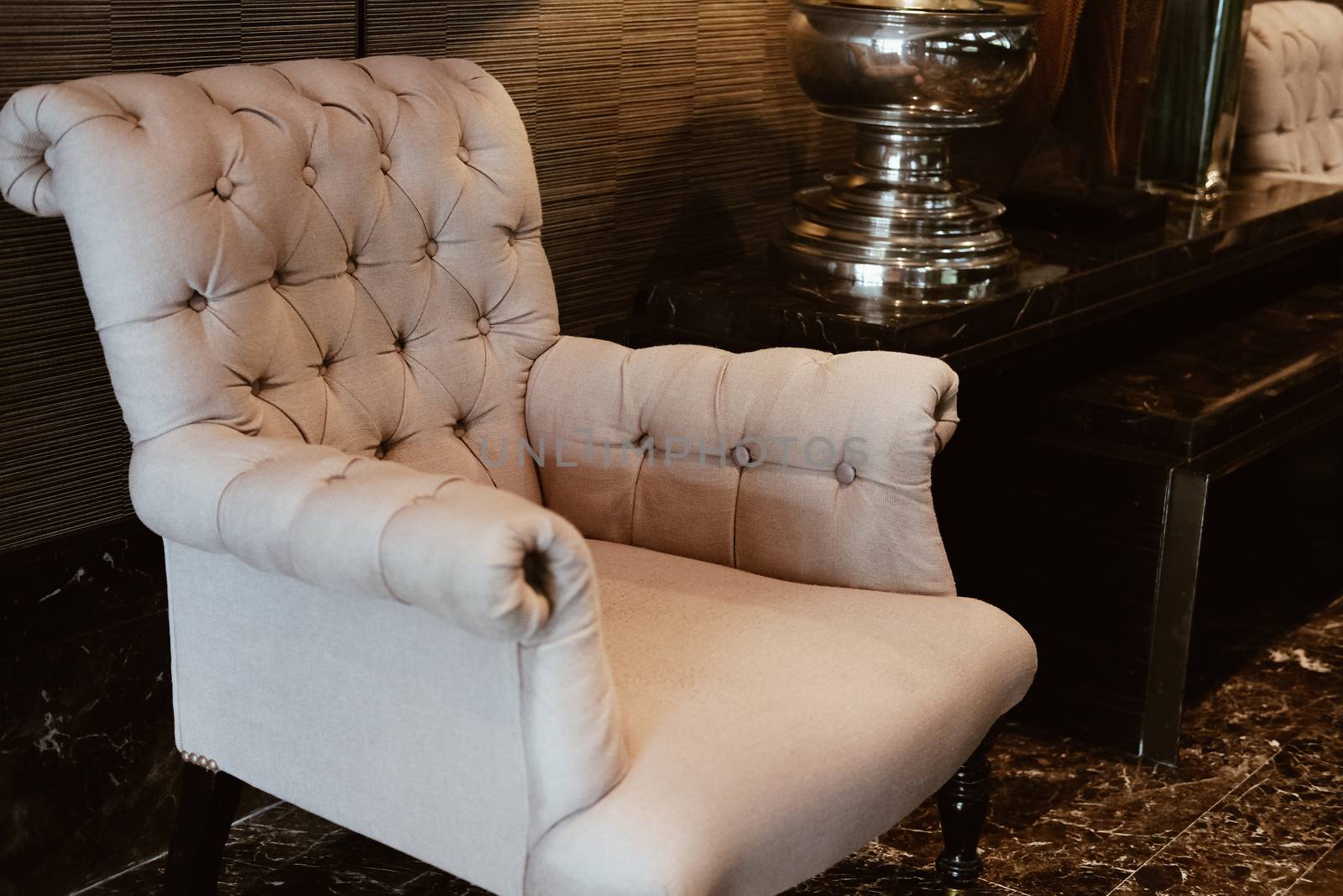 beige cushion sofa chair armchair in living room. home interior