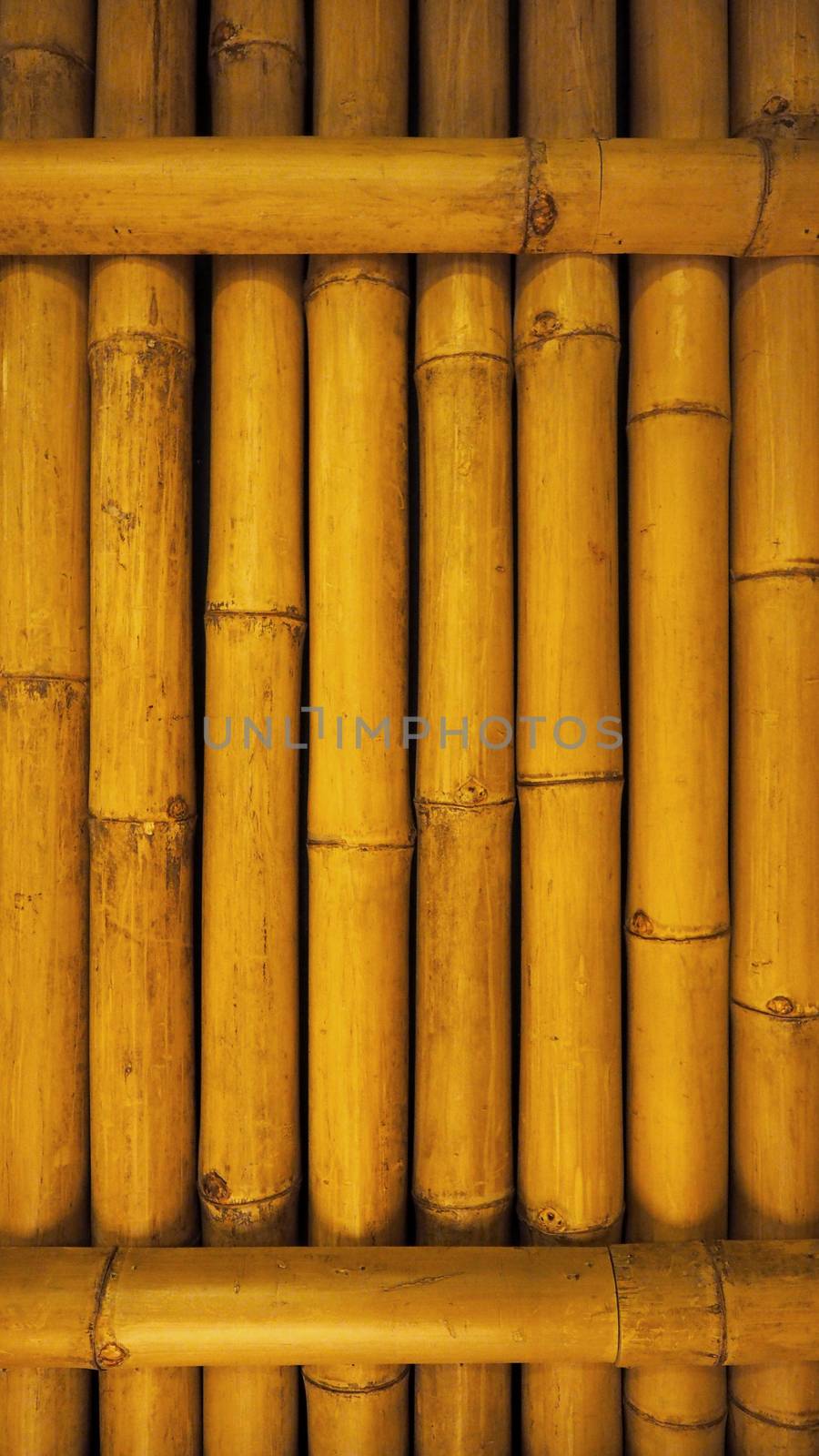 Old dirty bamboo background wall from real nature. by gnepphoto