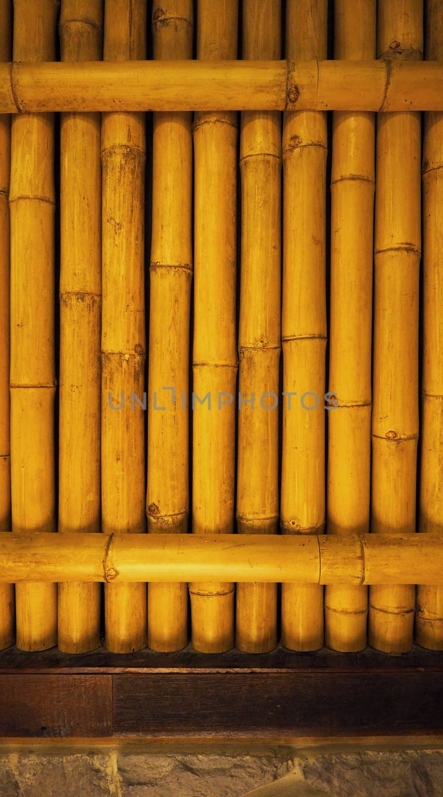 Old dirty bamboo background wall from real nature. by gnepphoto