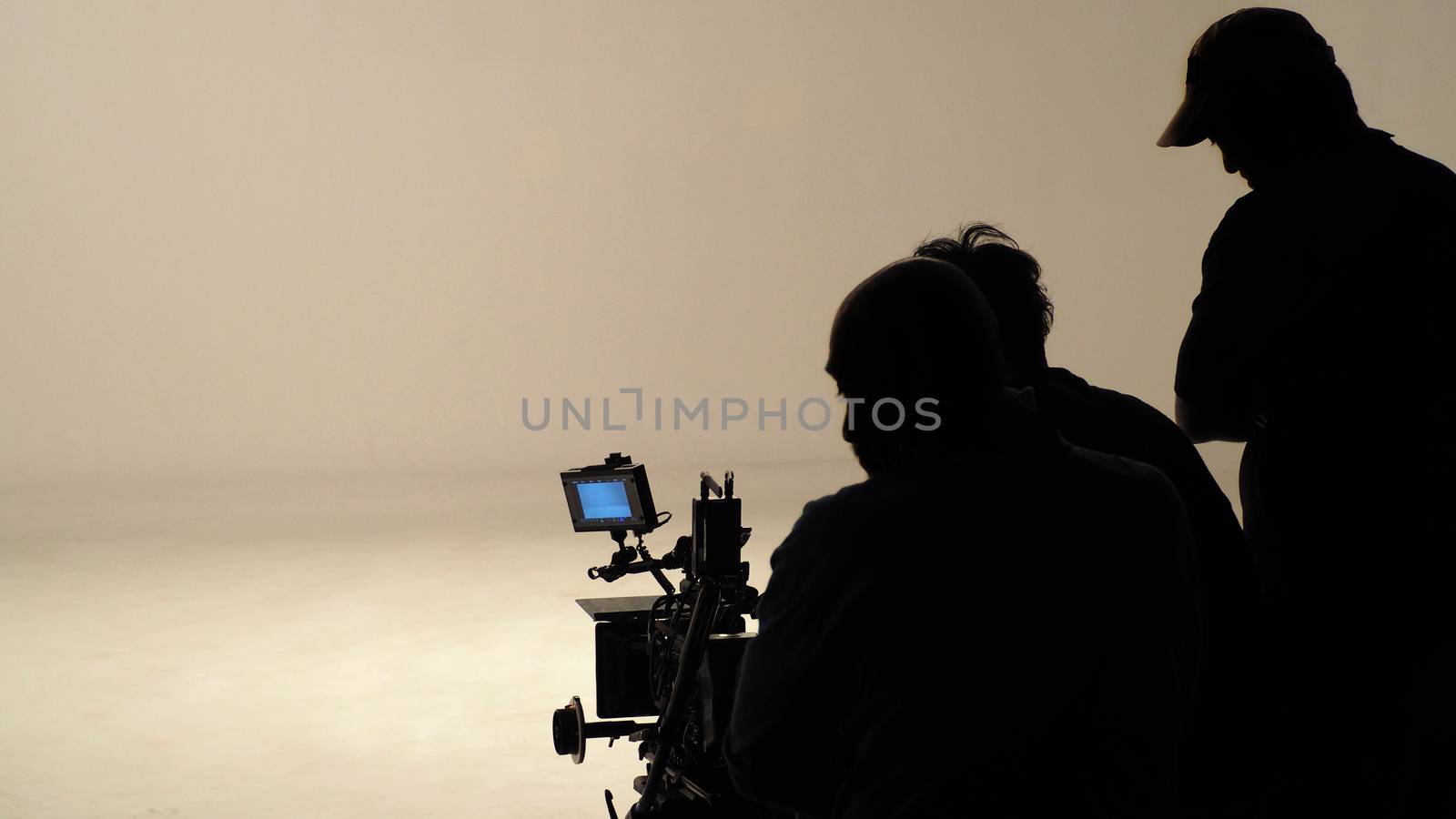 Silhouette of working people or production film crew are making  by gnepphoto