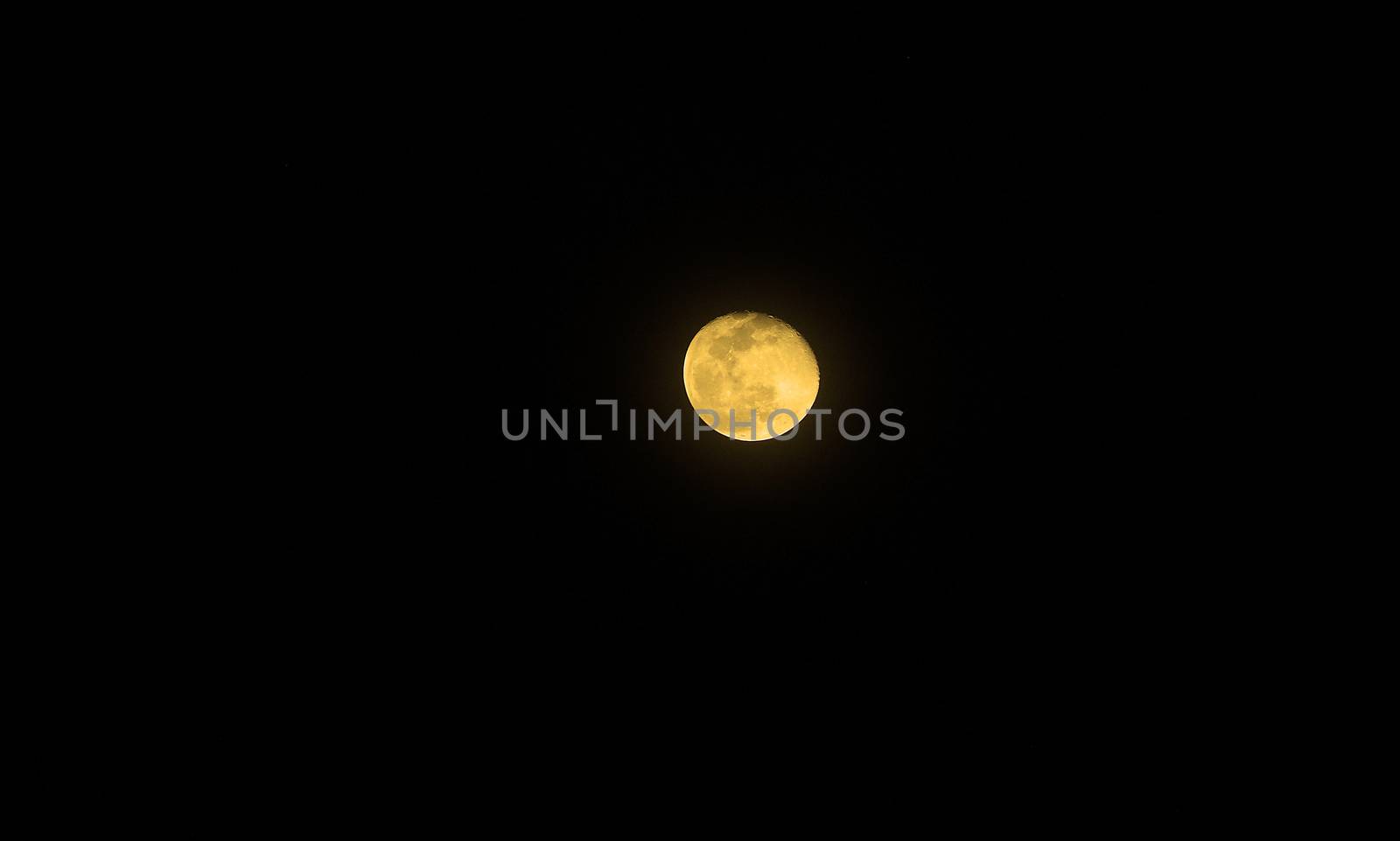 Moon with color on the dark sky at night and isolated black background.