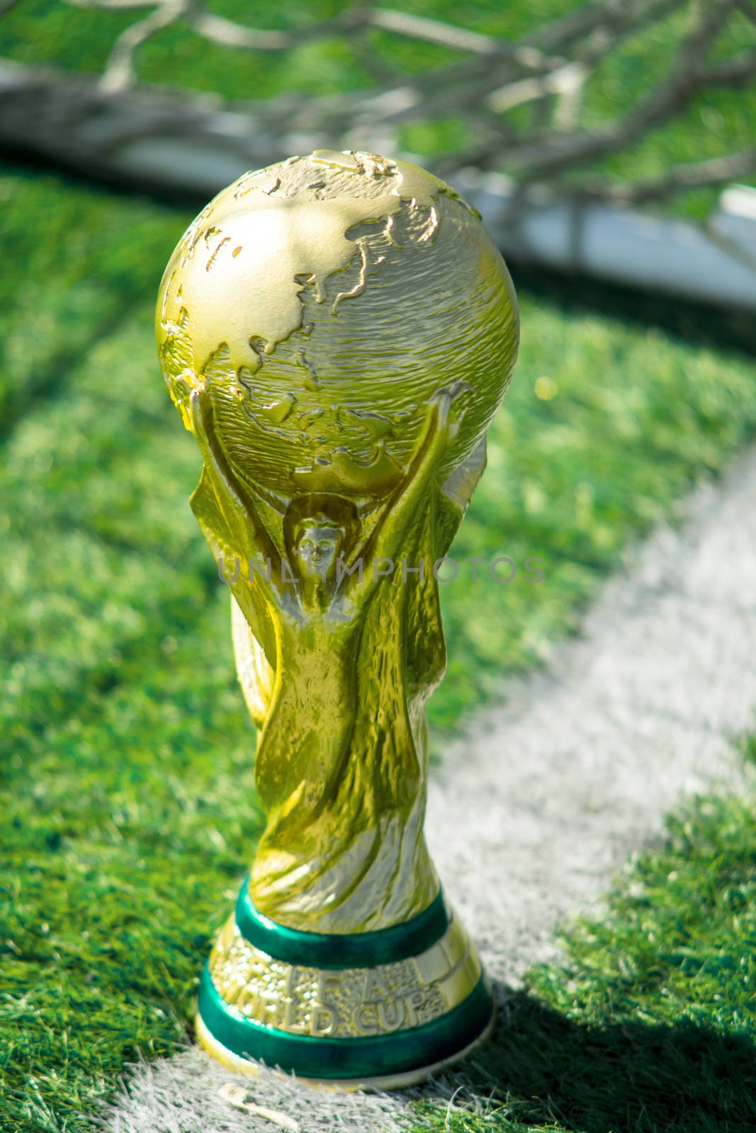 April 9, 2018 Moscow, Russia Trophy of the FIFA World Cup on the green grass of the football field.