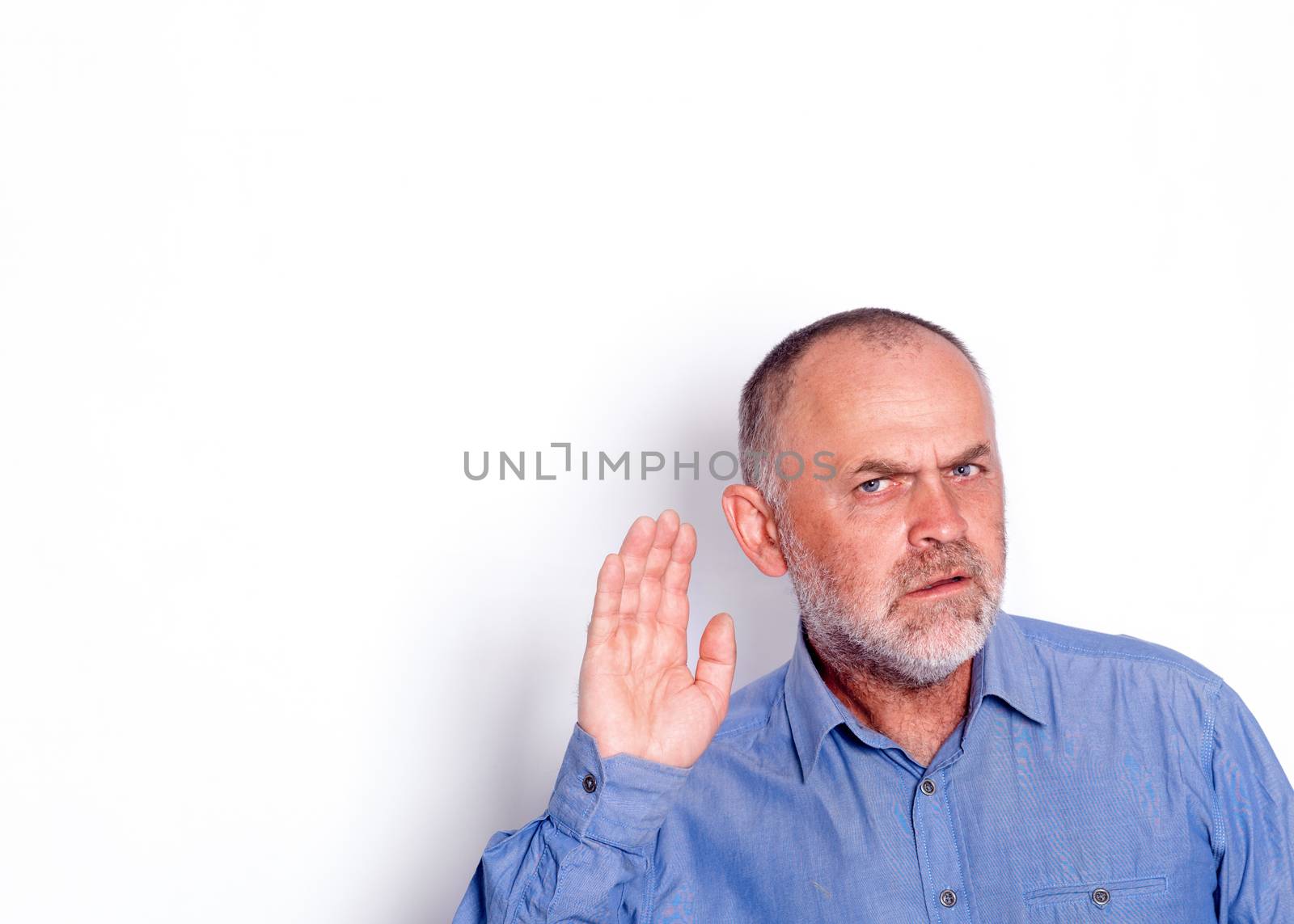 the man in blue shirt putting his hand near his ear on white background