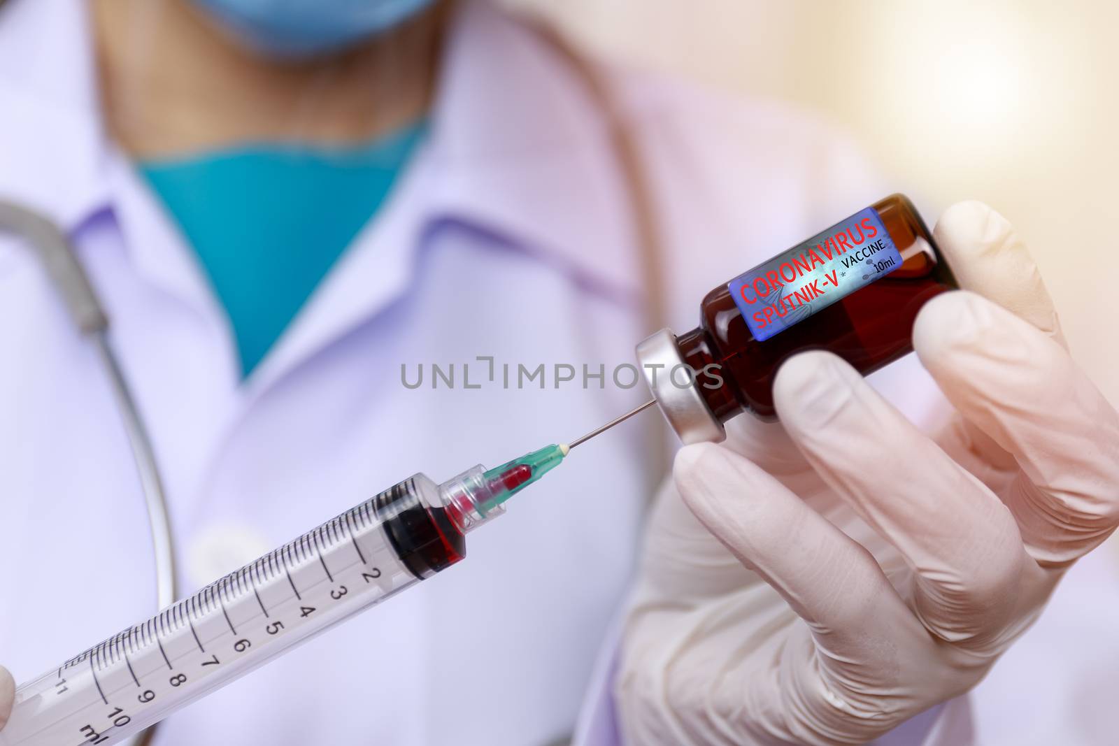 Covid-19, Coronavirus vaccine concept. Doctor, nurse, scientist, researcher hand in latex gloves holding vaccine in glass vial, Hands of doctor holding syringe and take vaccine from glass vial.