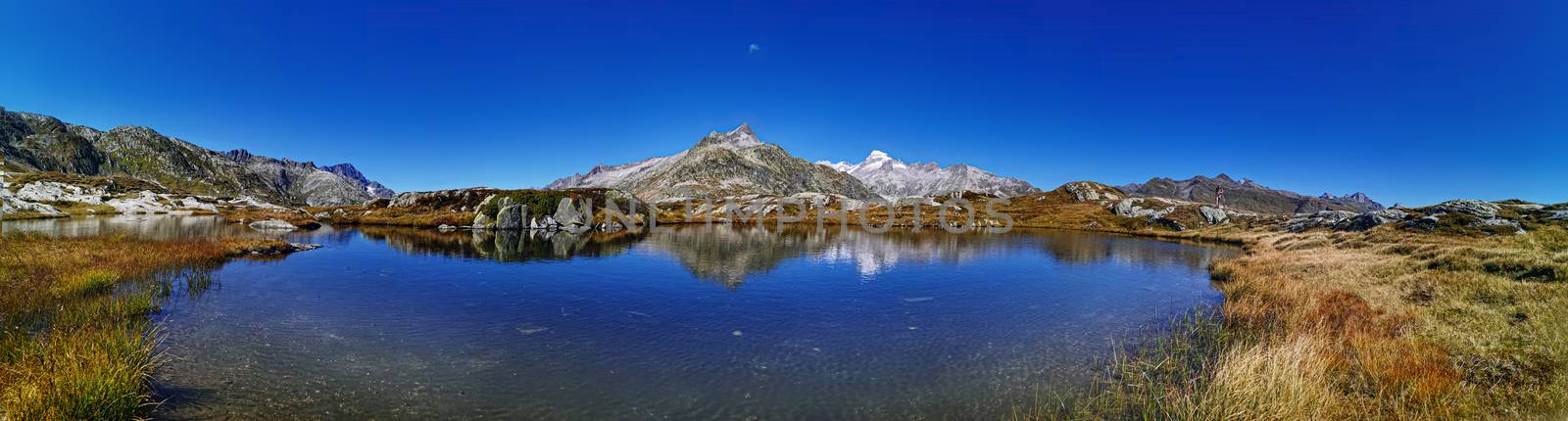 panorama scenery of the swiss alps. Lake at the top of grimsel p by PeterHofstetter