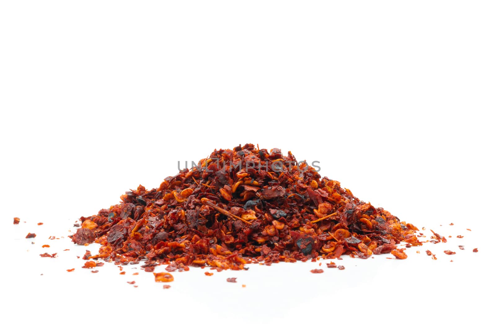 Dried chili meal on a white background by sompongtom