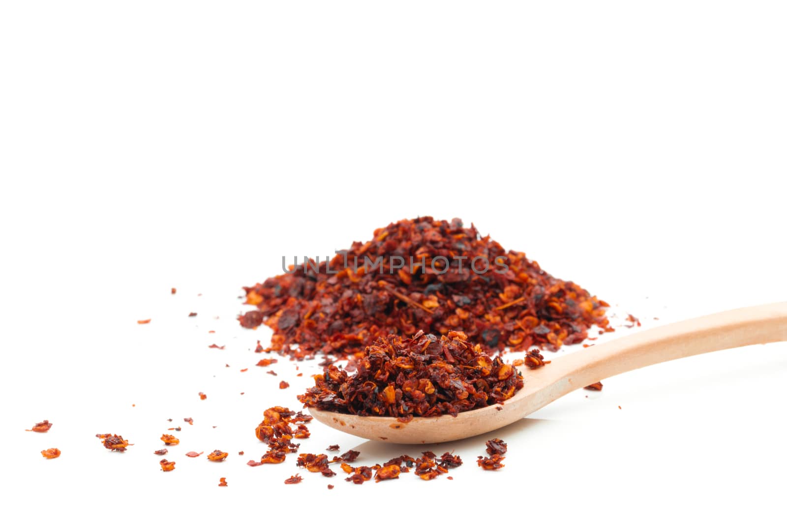 Dried chili meal on a white background