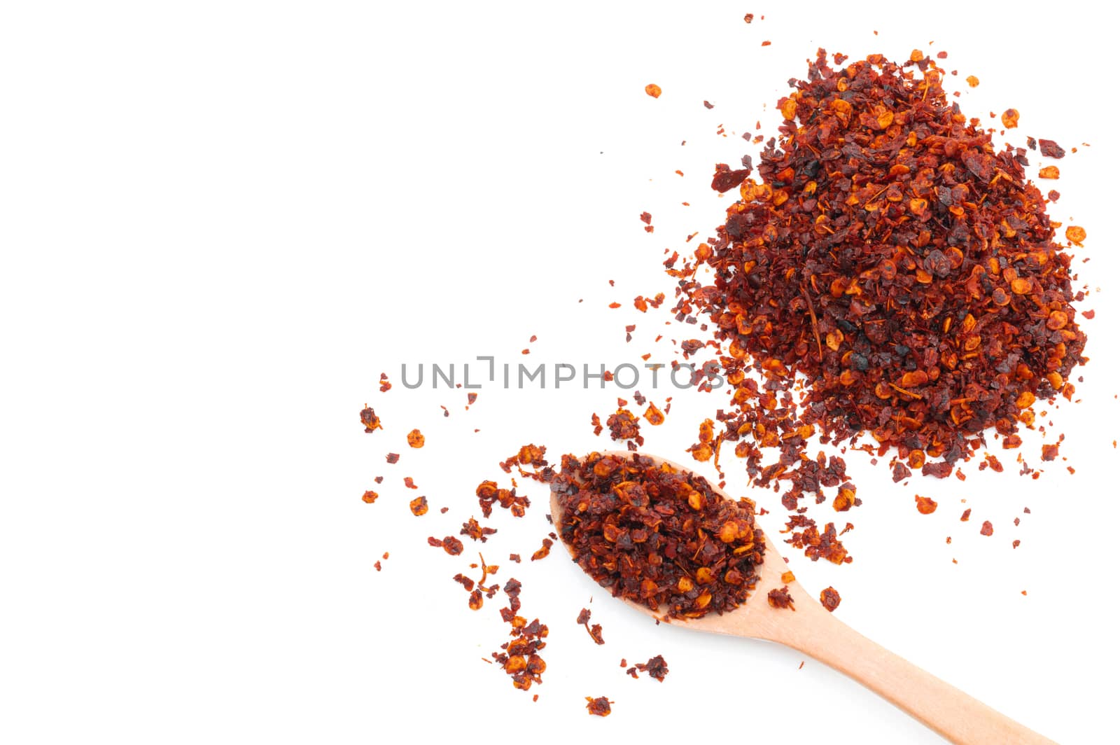 Dried chili meal on a white background