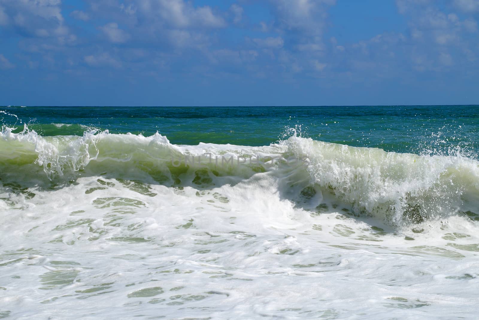 big white waves hitting the sea shore by Annado