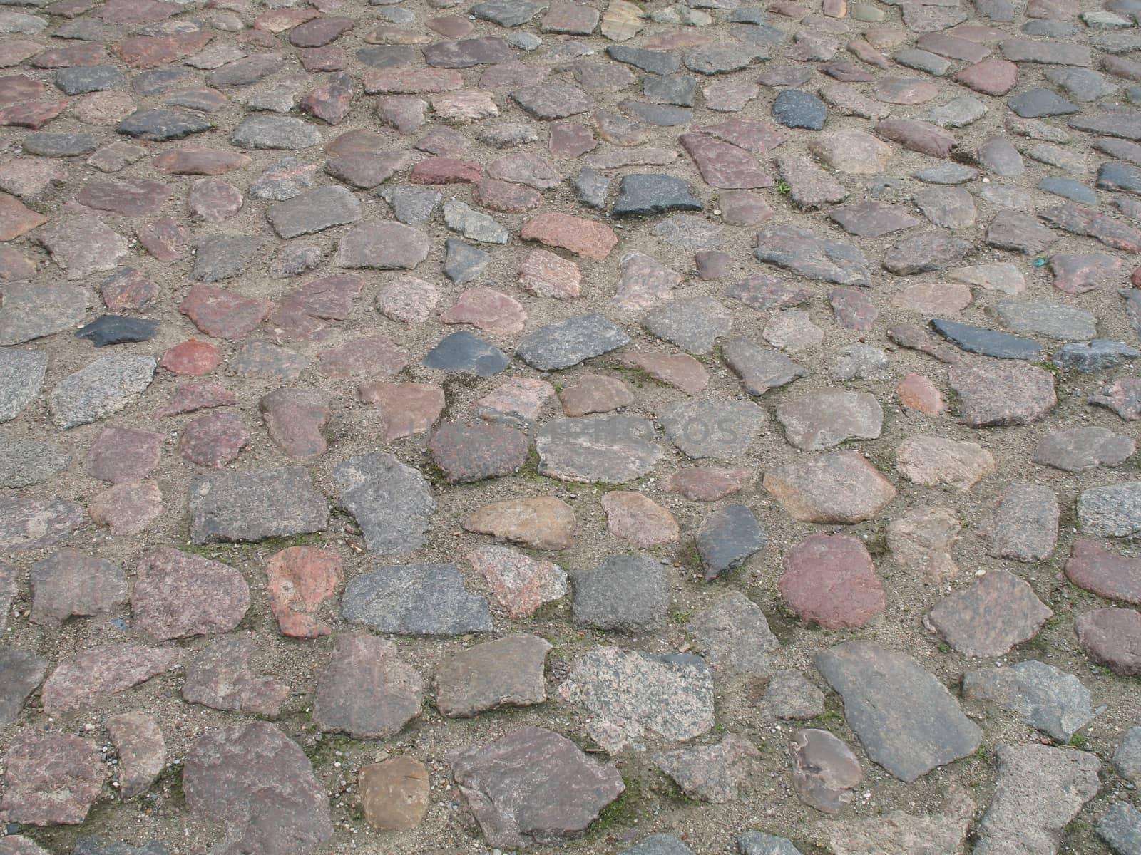 A road that is paved with cobblestones.