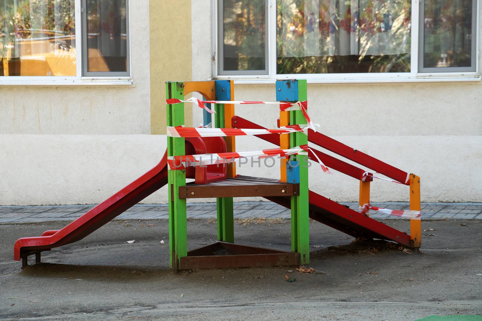 children's slide wrapped in a barrier tape by Annado