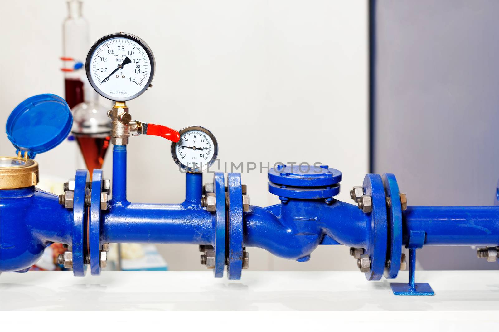 An example of the installation of a metering system and water pressure, close-up of pressure gauges, pipes and taps, copy space.