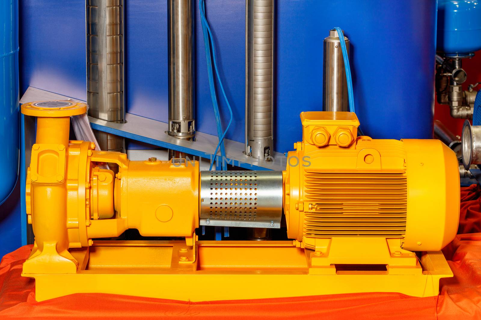 Industrial pumping equipment, stationary type electric powerful yellow sewage pump at the exhibition stand.
