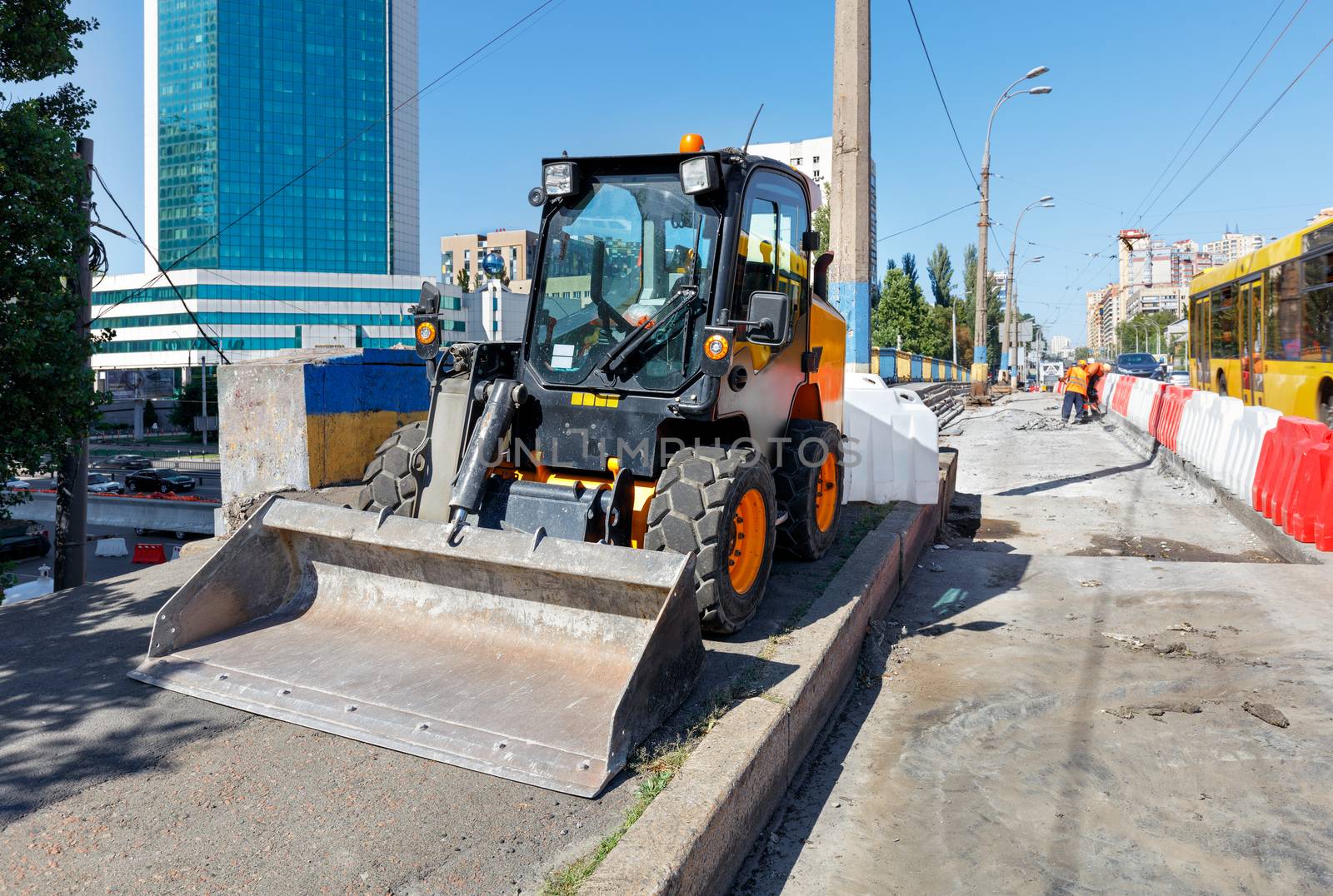 Lightweight and maneuverable construction bulldozer stands when repairing the road. by Sergii