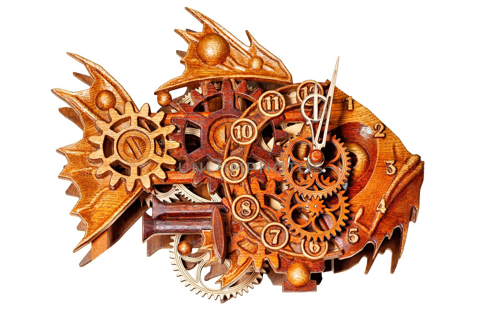 Beautiful and unusual wooden wall clock made of wooden parts on the dial in the form of a predatory fish with carved elements. Image isolated on white background.