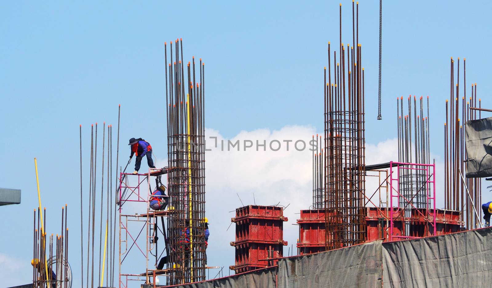 Labor working on construction site by gnepphoto