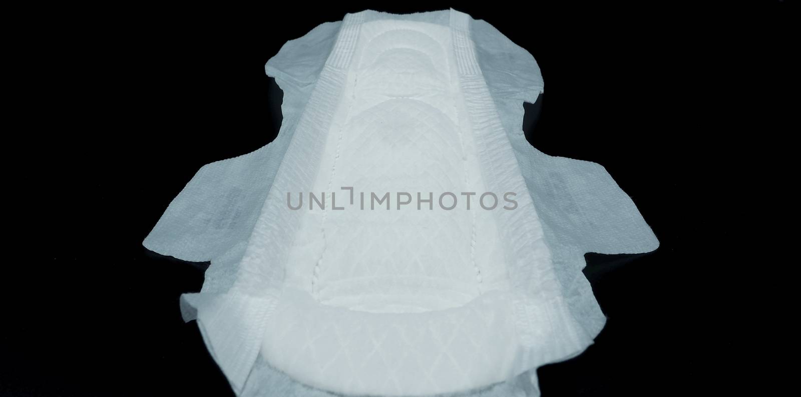 Sanitary napkin white color on black background. by gnepphoto